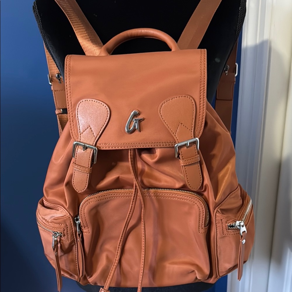 Tan Leather Backpack with Flap Closure and Adjustable Straps